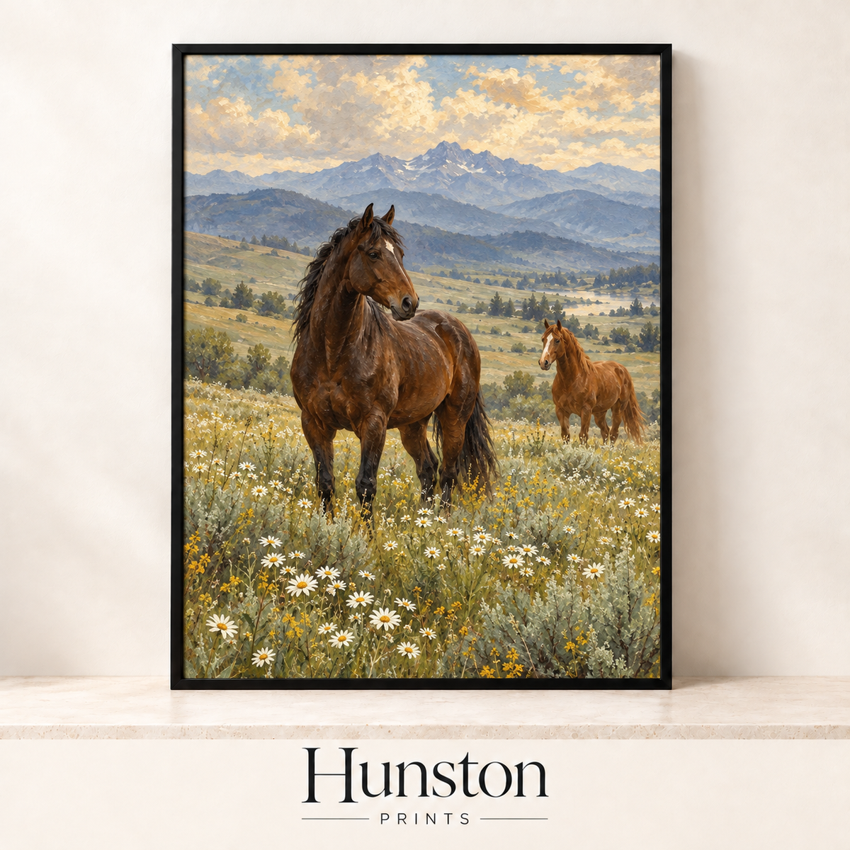 Two brown horses in a wildflower meadow with mountains in the distance