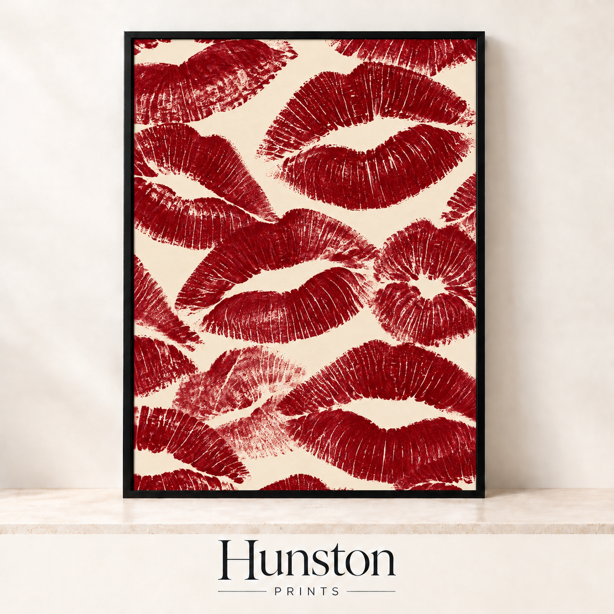 Deep red lipstick kiss prints scattered across a cream background