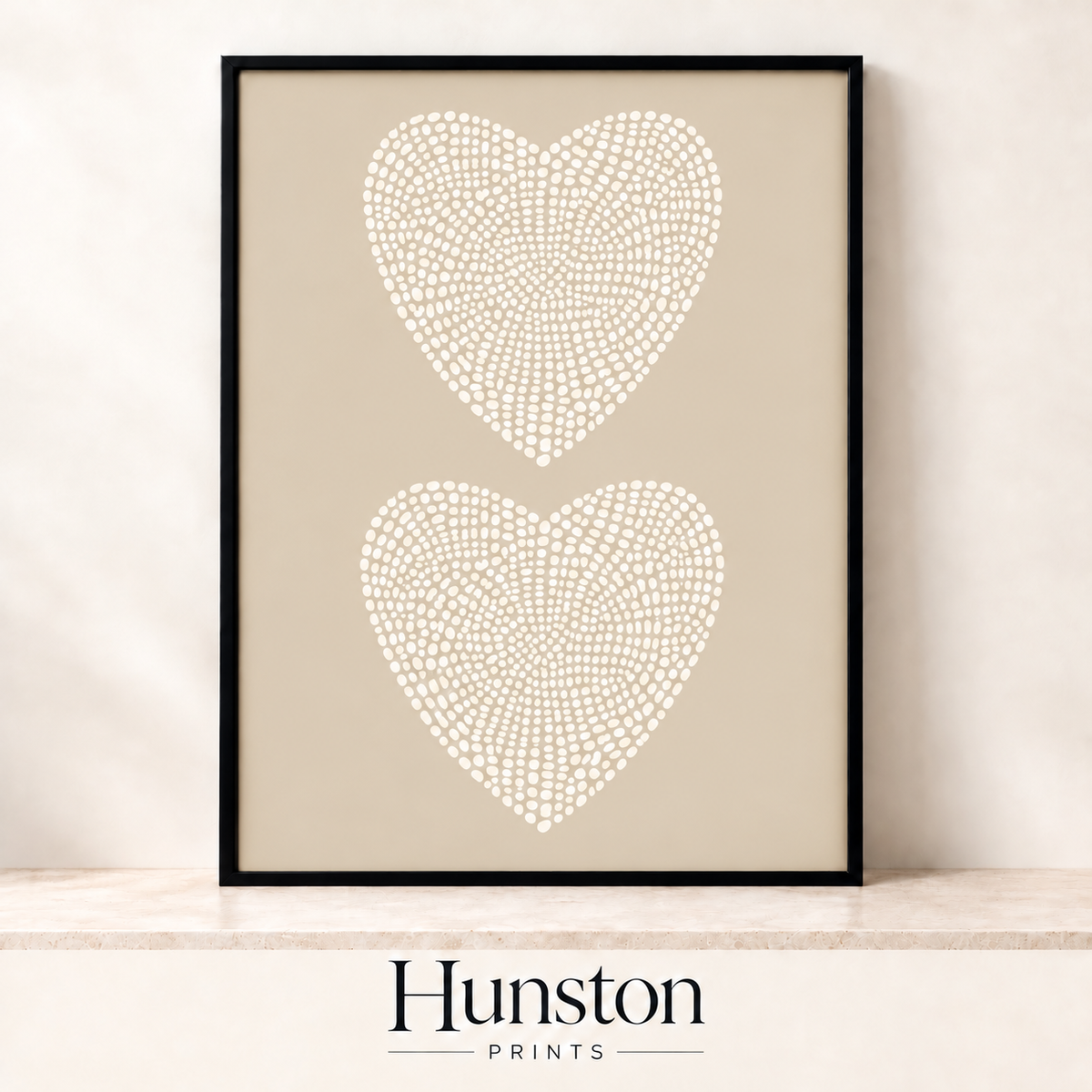 Two hearts made of cream dots on a beige background