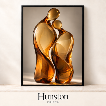 Two amber glass figures leaning together in an embrace
