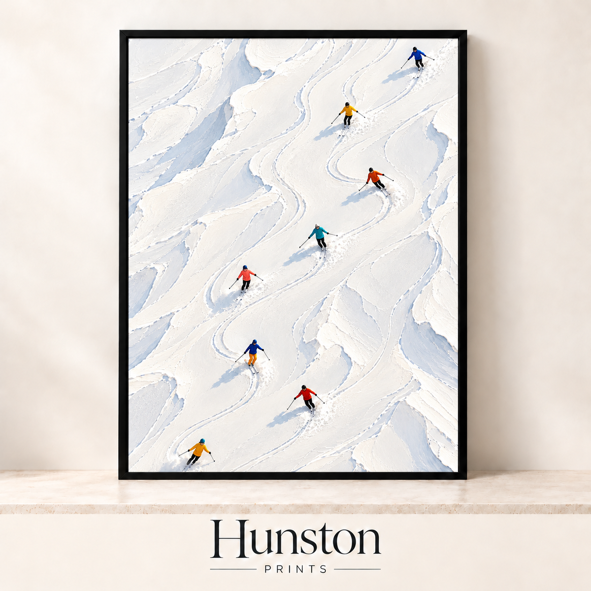 Colourful skiers carving tracks down a snowy slope