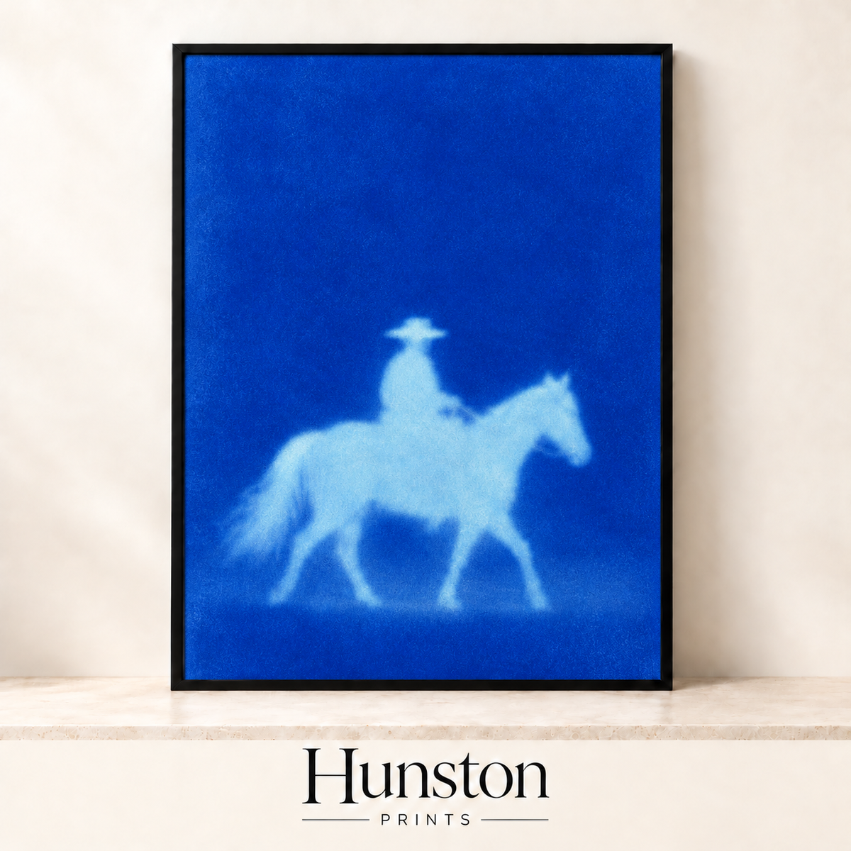 Glowing silhouette of a cowboy on horseback on cobalt blue
