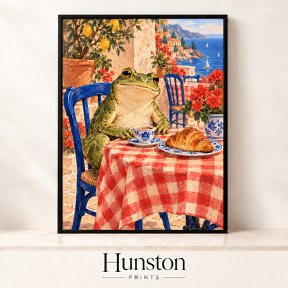 Frog at a gingham café table with coffee and a croissant overlooking the sea