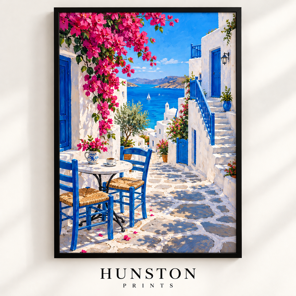 Greek island street café with blue chairs, white steps and pink bougainvillea overlooking the sea