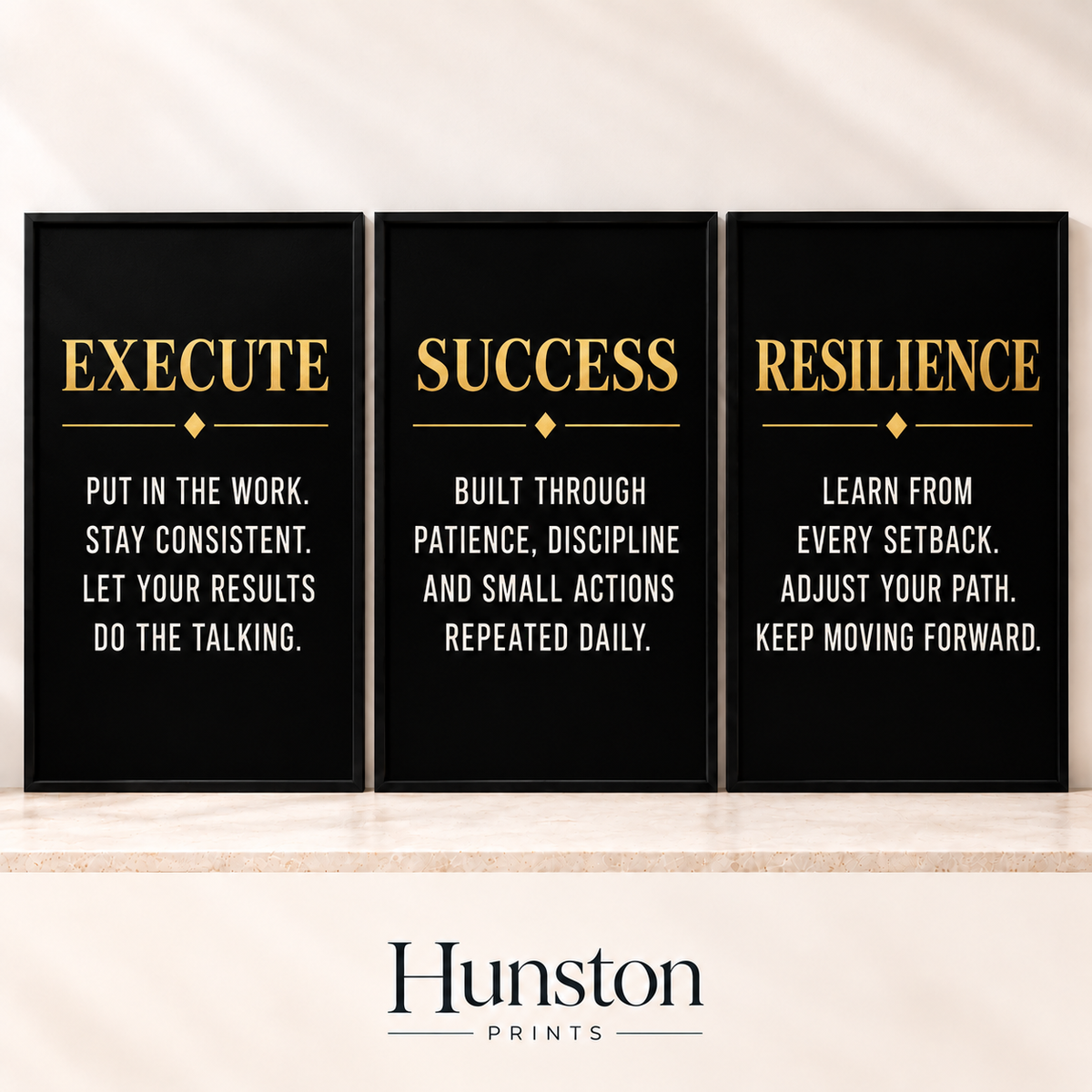 Set of three black and gold prints reading Execute, Success and Resilience
