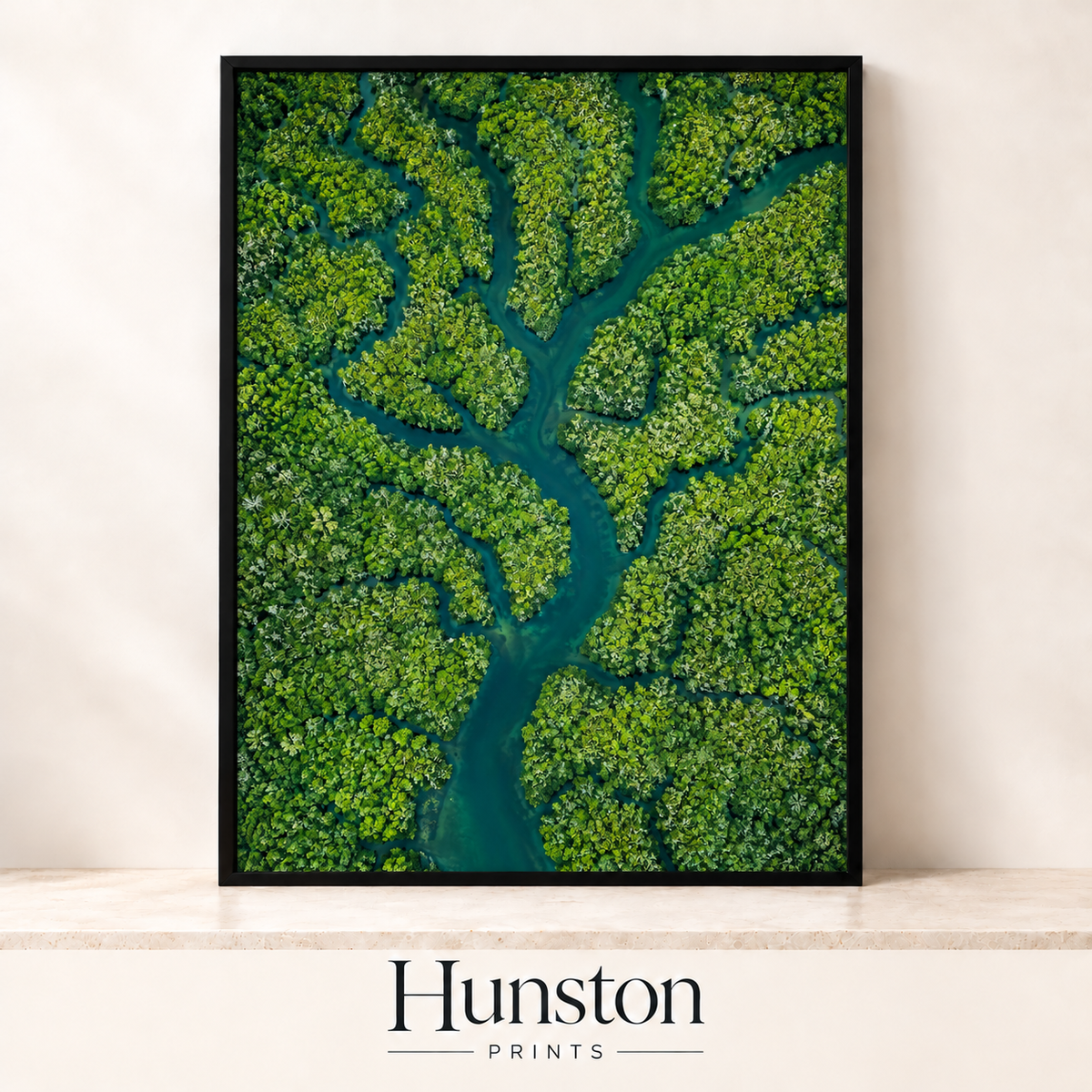 Aerial view of a turquoise river branching through green rainforest