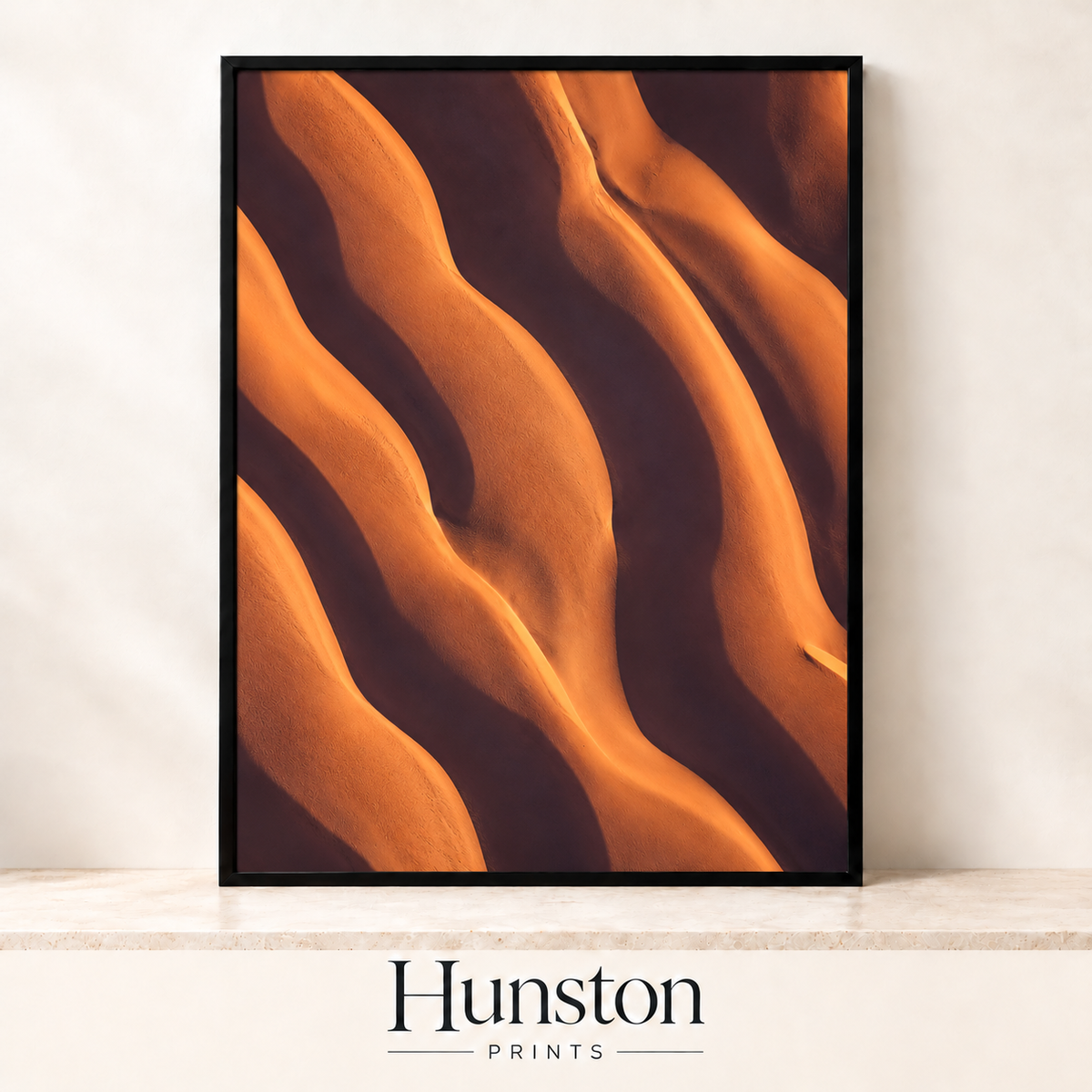 Close-up of rolling orange sand dune ridges in shadow