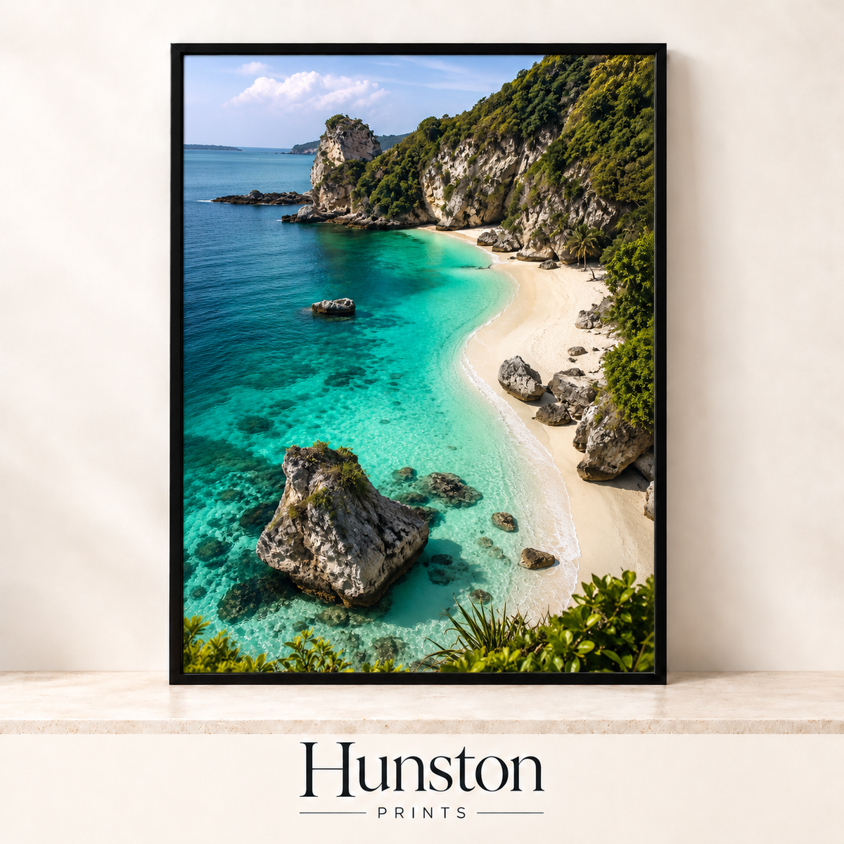 Secluded white sand cove with turquoise water and green cliffs