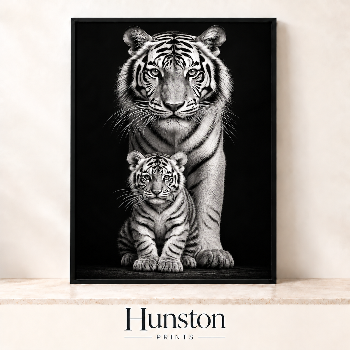 Black and white tiger standing behind its cub