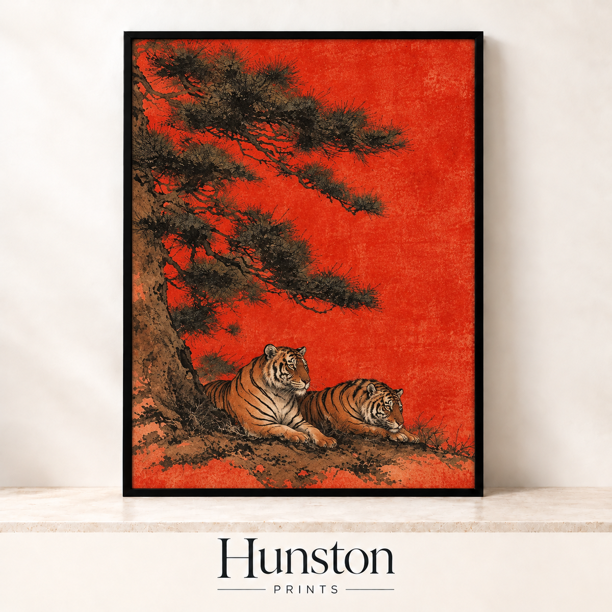 Two tigers resting under a pine tree on a red background