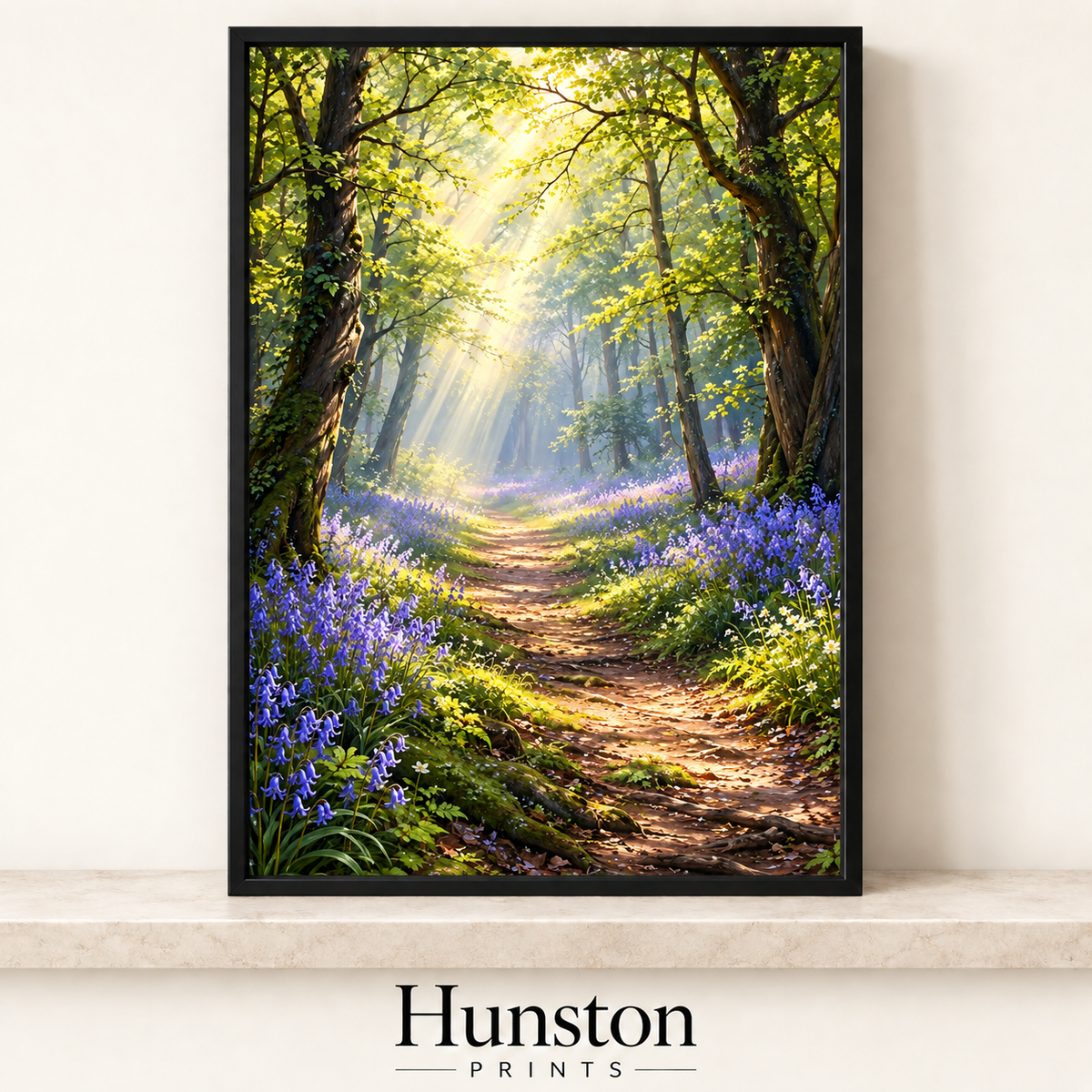 Sunlit woodland path lined with bluebells beneath beech trees