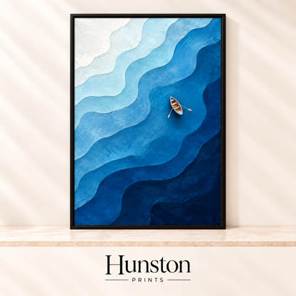 Small rowing boat on layered textured blue waves seen from above