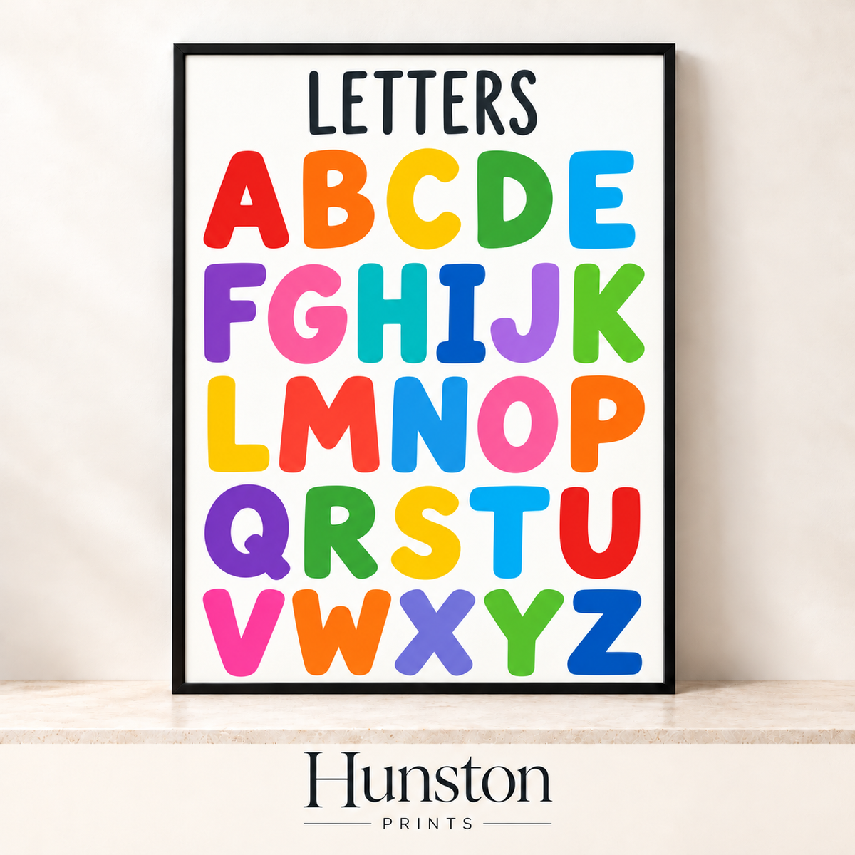 Rainbow capital letters A to Z on white