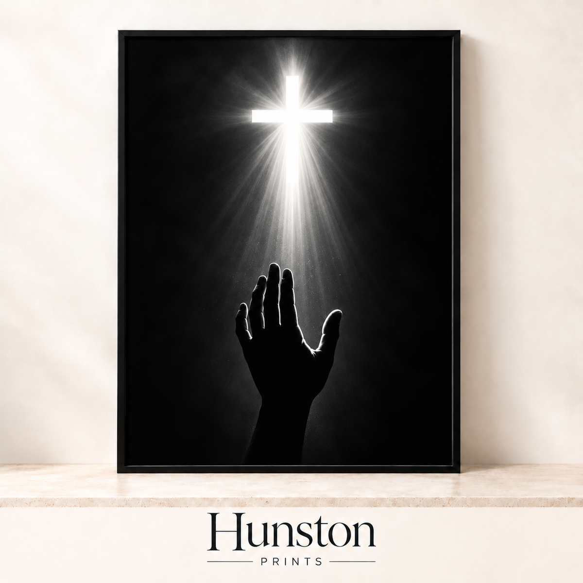 Hand reaching up towards a glowing cross in black and white