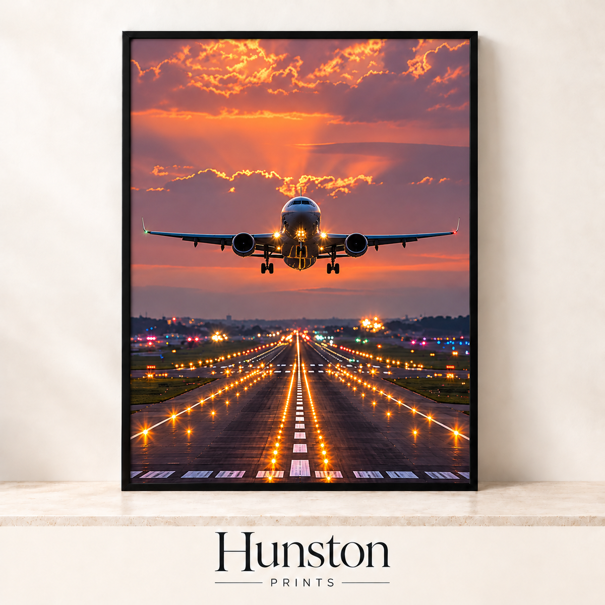 Plane taking off over a lit runway at sunset